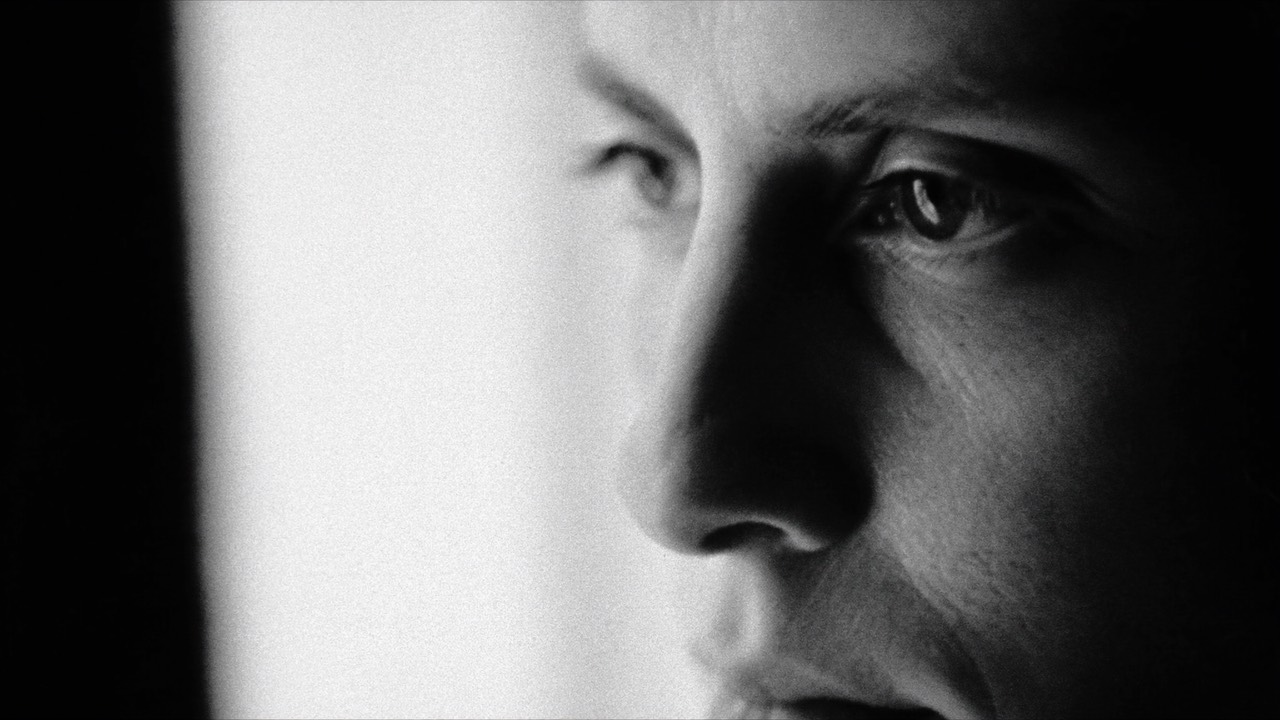 Close-up of a pensive face in soft window light